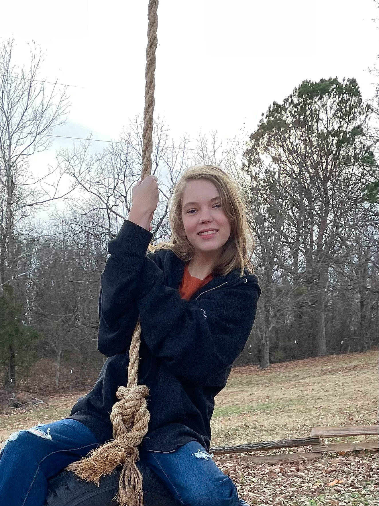 Ivy joined the competition — help win amazing prizes! branch, clothing, face, facial_expression, flash_photography, gesture, grass, hair, hairstyle, happy, human_body, jacket, joy, people_in_nature, person, plant, sky, smile, standing, tree