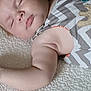 baby, sleeping, arm, blanket, clothing, pattern, zigzag, texture, cute, infant, peaceful, soft, resting, toddler, child, portrait, closeup, indoor, wearing, colorful