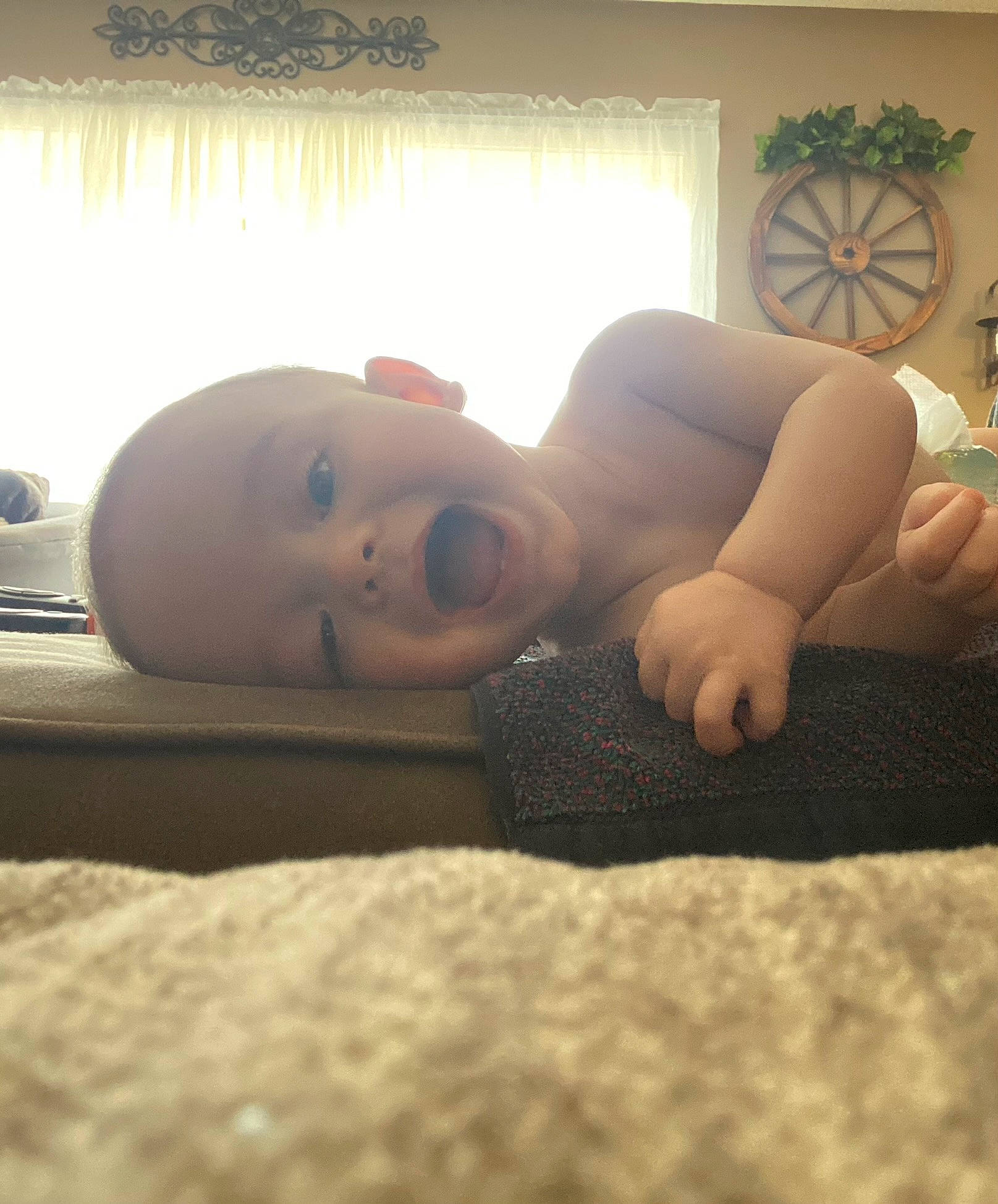 Jaxson is registered to the contest to win money with this photo: audio_equipment, chest, comfort, couch, eye, eyewear, floor, flooring, gadget, hardwood, human_body, human_leg, linens, mechanical_fan, person, selfie, sitting, thigh, tints_and_shades, window