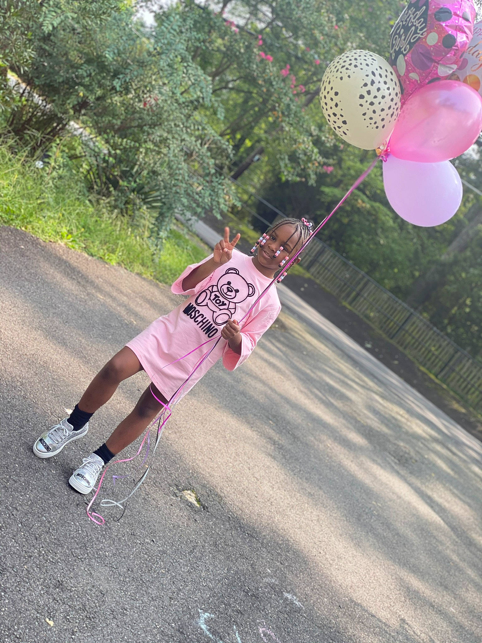 Paige joined the competition — help win amazing prizes! asphalt, ball, balloon, basketball_court, fun, grass, happy, joy, knee, leg, leisure, magenta, person, pink, plant, recreation, shorts, sports_equipment, sportswear, streetball