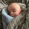 Memphis is registered to the contest to win money with this photo: baby, sleeping, blanket, towel, bed, bedding, face, infant, cozy, soft, peaceful, child, rest, portrait, wrapped, comfort, indoors, cute, young, nap