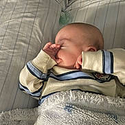Memphis joined the competition — help win amazing prizes! baby, sleeping, blanket, bed, pacifier, striped_sweater, infant, cozy, cute, child, sleep, soft, hand, face, indoors, rest, comfort, peaceful, lying_down, young