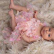 Alba a rejoint le concours — aidez-le/la à gagner de superbes lots ! baby, infant, pink_dress, headband, bow, blue_eyes, fluffy_rug, soft_texture, lying_down, cute, adorable, child, portrait, baby_girl, tulle, butterfly_decorations, skin, small_hands, small_feet, calm