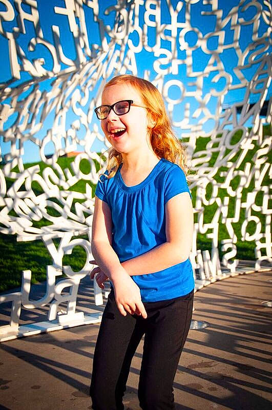 Maddy is registered to the contest to win money with this photo: beauty, blue, cool, electric_blue, eyewear, fashion, fun, girl, glasses, hair, jeans, long_hair, pattern, person, photo_shoot, photography, product, shoulder, smile, sunglasses