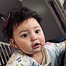 baby, child, colorful, cozy, curly_hair, cute, doodle, earrings, eyes, face, hand, happy_life, home, indoor, person, portrait, shirt, smiling, staircase, window