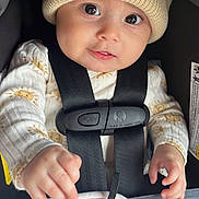 Fiorella joined the competition — help win amazing prizes! baby, infant, child, car_seat, knit_hat, pajamas, sun_pattern, straps, blanket, hands, face, eyes, cute, cozy, indoors, security, portrait, young, smiling, clothing