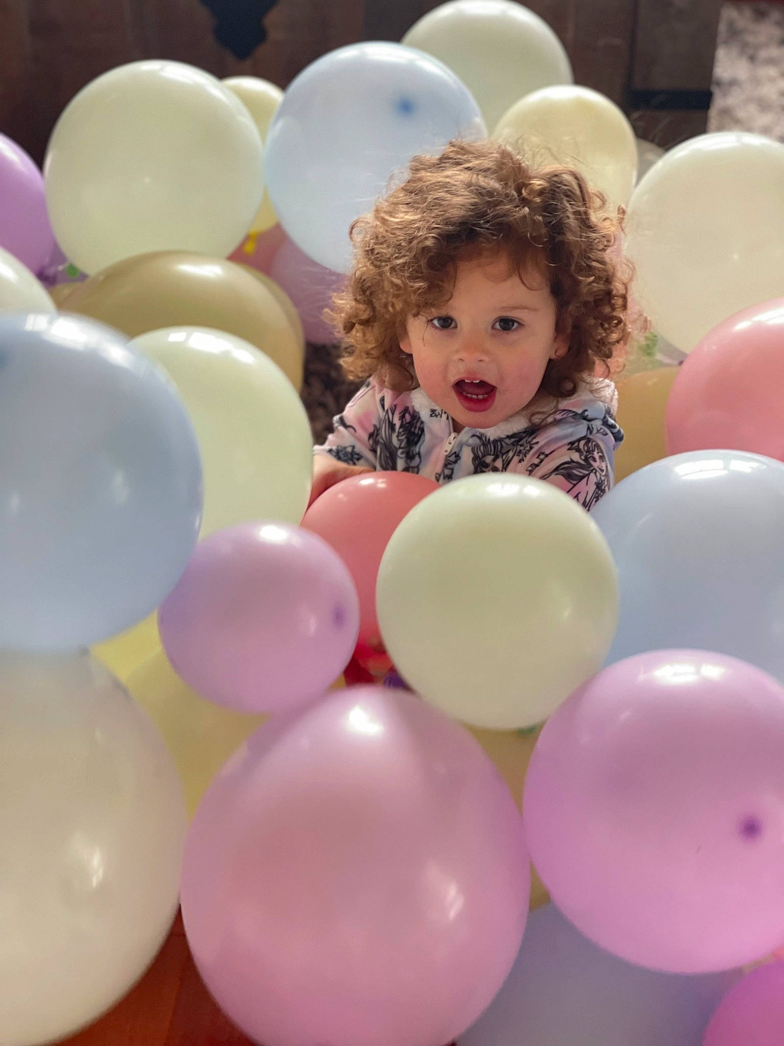 Savannah is registered to the contest to win money with this photo: balloon, child, community, daytime, event, facial_expression, fun, hair, happy, head, human, interaction, leisure, magenta, organ, party_supply, person, pink, social_group, surprise