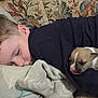 Maël a rejoint le concours — aidez-le/la à gagner de superbes lots ! child, puppy, sleeping, blanket, bed, pillow, face, cozy, animal, young, indoors, resting, cute, pet, comfort, clothing, head, peaceful, person, nap