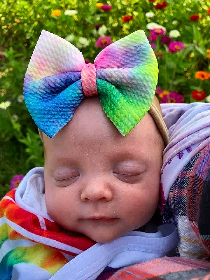 Bexley is registered to the contest to win money with this photo: baby, baby_toddler_clothing, beauty, cap, cool, costume_hat, face, grass, happy, headgear, headwear, knit_cap, magenta, outerwear, pattern, people_in_nature, person, photograph, pink, purple