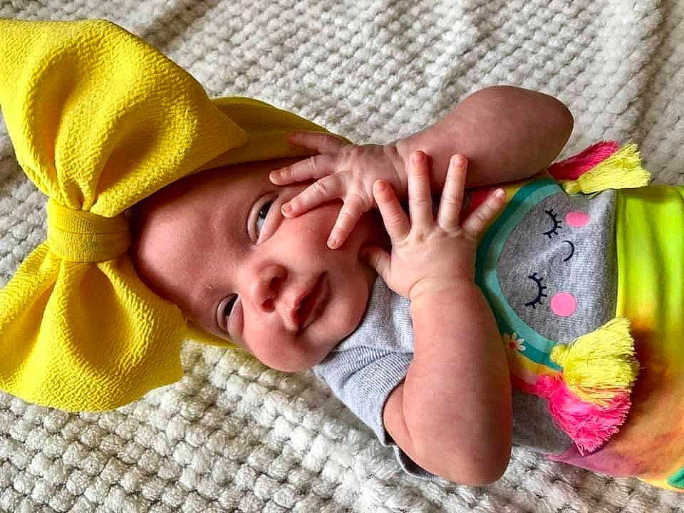 Bexley is registered to the contest to win money with this photo: baby, baby_sleeping, baby_toddler_clothing, comfort, eye, facial_expression, finger, hand, happy, headgear, linens, mouth, nose, person, pink, product, skin, sleeve, smile, thumb