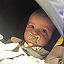 Mirann a rejoint le concours — aidez-le/la à gagner de superbes lots ! baby, baby_carrier, blanket, car_seat, child, closeup, clothing, comfort, cute, face, indoors, infant, pacifier, people, portrait, resting, safety, seatbelt, soft_light, young_child