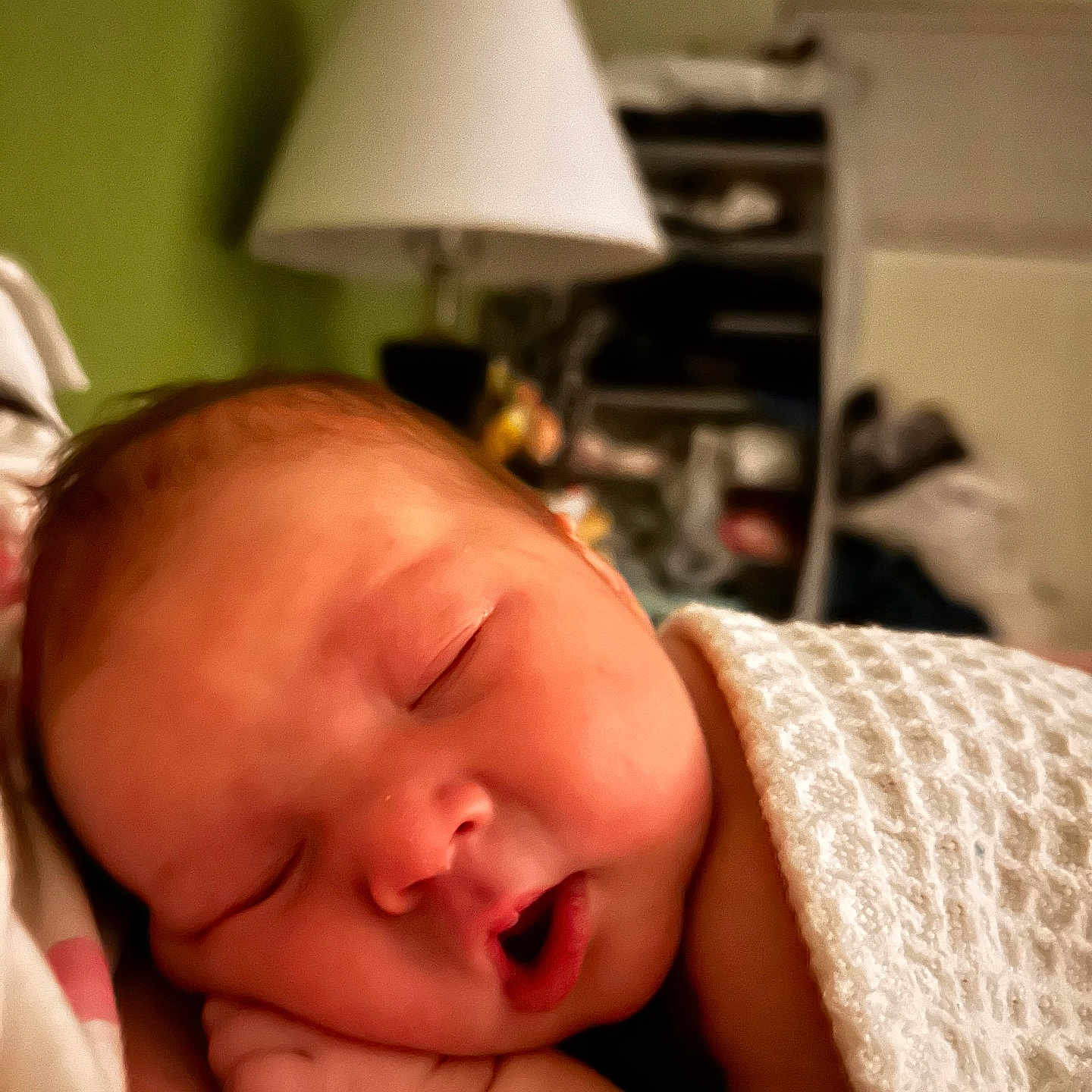 Lexani is registered to the contest to win money with this photo: baby, bedroom, blanket, blurred_background, child, closeup, cozy, face, hand, indoors, infant, lamp, mouth, newborn, peaceful, portrait, rest, skin, sleeping, soft_light