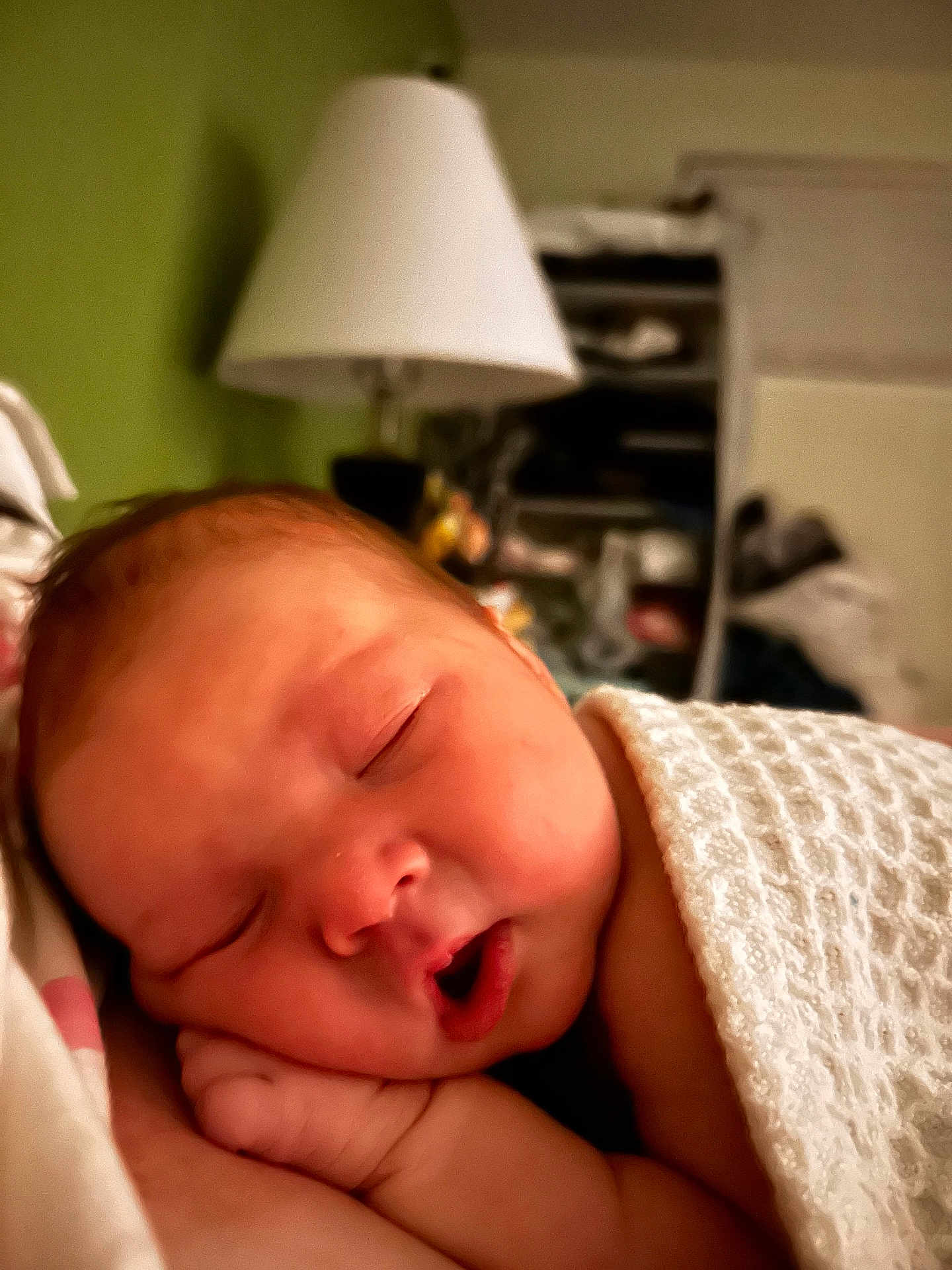 Lexani is registered to the contest to win money with this photo: baby, newborn, sleeping, blanket, face, peaceful, infant, hand, mouth, cozy, bedroom, lamp, blurred_background, soft_light, portrait, rest, child, indoors, closeup, skin