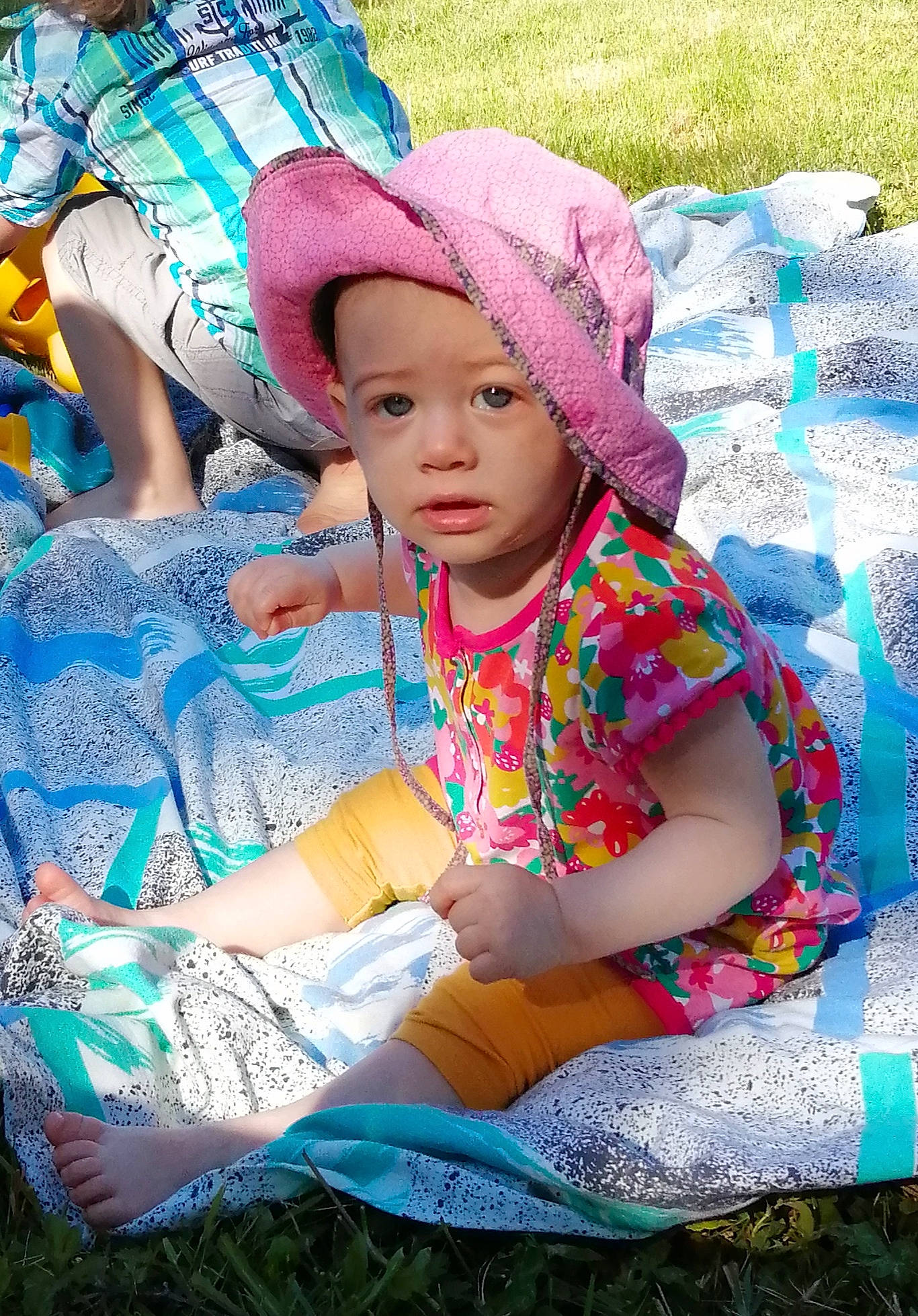 Rachel a rejoint le concours — aidez-le/la à gagner de superbes lots ! baby, baby_toddler_clothing, cap, child, event, fun, grass, happy, hat, headwear, leisure, magenta, people, person, photograph, picnic, pink, recreation, summer, sun_hat