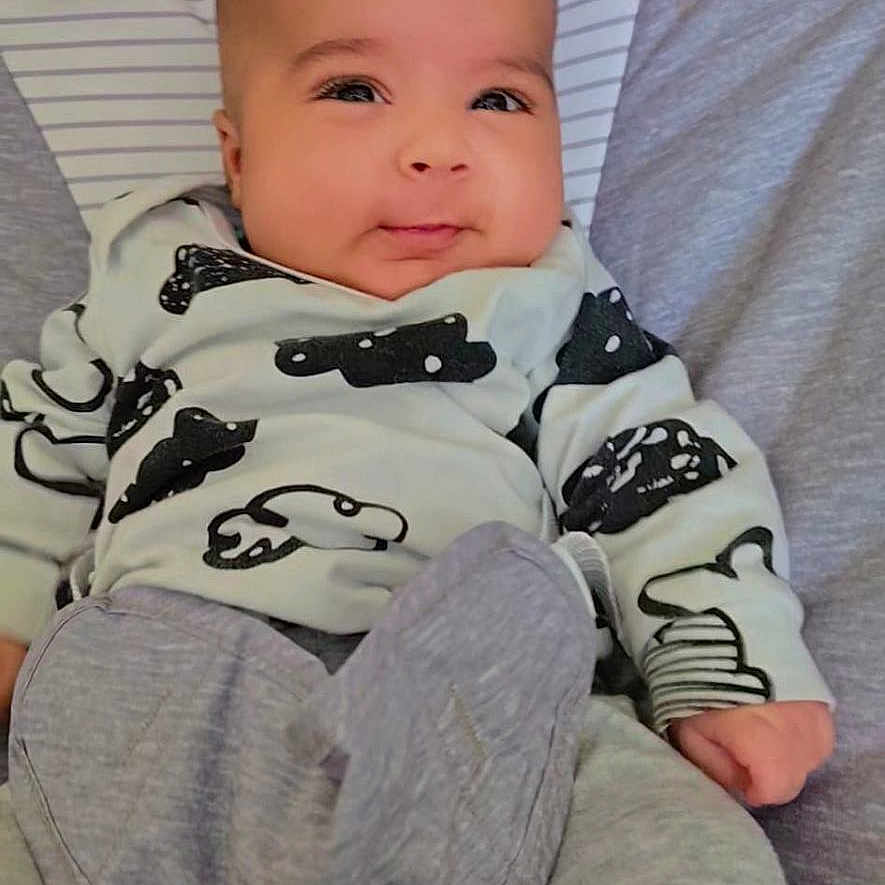 Kabir joined the competition — help win amazing prizes! baby, bed, blanket, clothing, couch, cushion, face, furniture, happy, head, homedecor, newborn, pants, person, photography, portrait, quilt, sitting, sleeping, smile