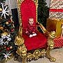 Dominic Nicolas is registered to the contest to win money with this photo: baby, child, red_throne, golden_chair, christmas_tree, ornaments, presents, holiday_decor, indoor, festive, celebration, red_clothing, white_socks, floor, wall, lights, decorations, furniture, portrait, young_child