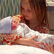 Zedadiah. joined the competition — help win amazing prizes! child, baby, newborn, holding, blanket, hat, girl, toddler, indoor, portrait, family, love, care, warmth, caring, closeup, people, human, face, expression