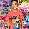 Derrick joined the competition — help win amazing prizes! child, boy, smiling, tshirt, cartoon, bear, hustle, graffiti, brick_wall, colorful, urban, casual_clothing, portrait, standing, happy, short_hair, background, street_art, fashion, youth