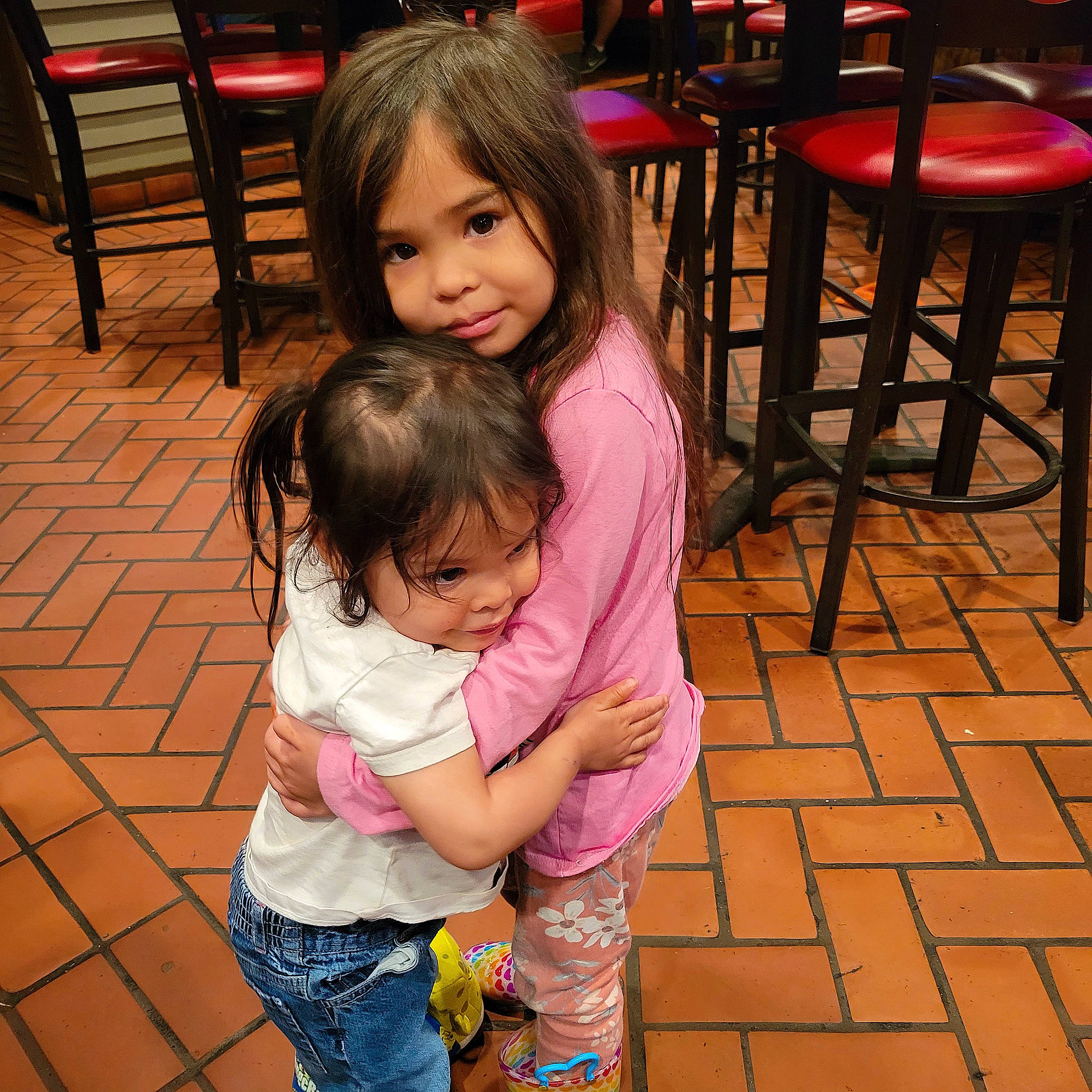 Jace is registered to the contest to win money with this photo: beauty, chair, cheek, child, eye, flooring, fun, hair, happy, iris, leg, leisure, organ, people, person, photograph, pink, skin, smile, snapshot