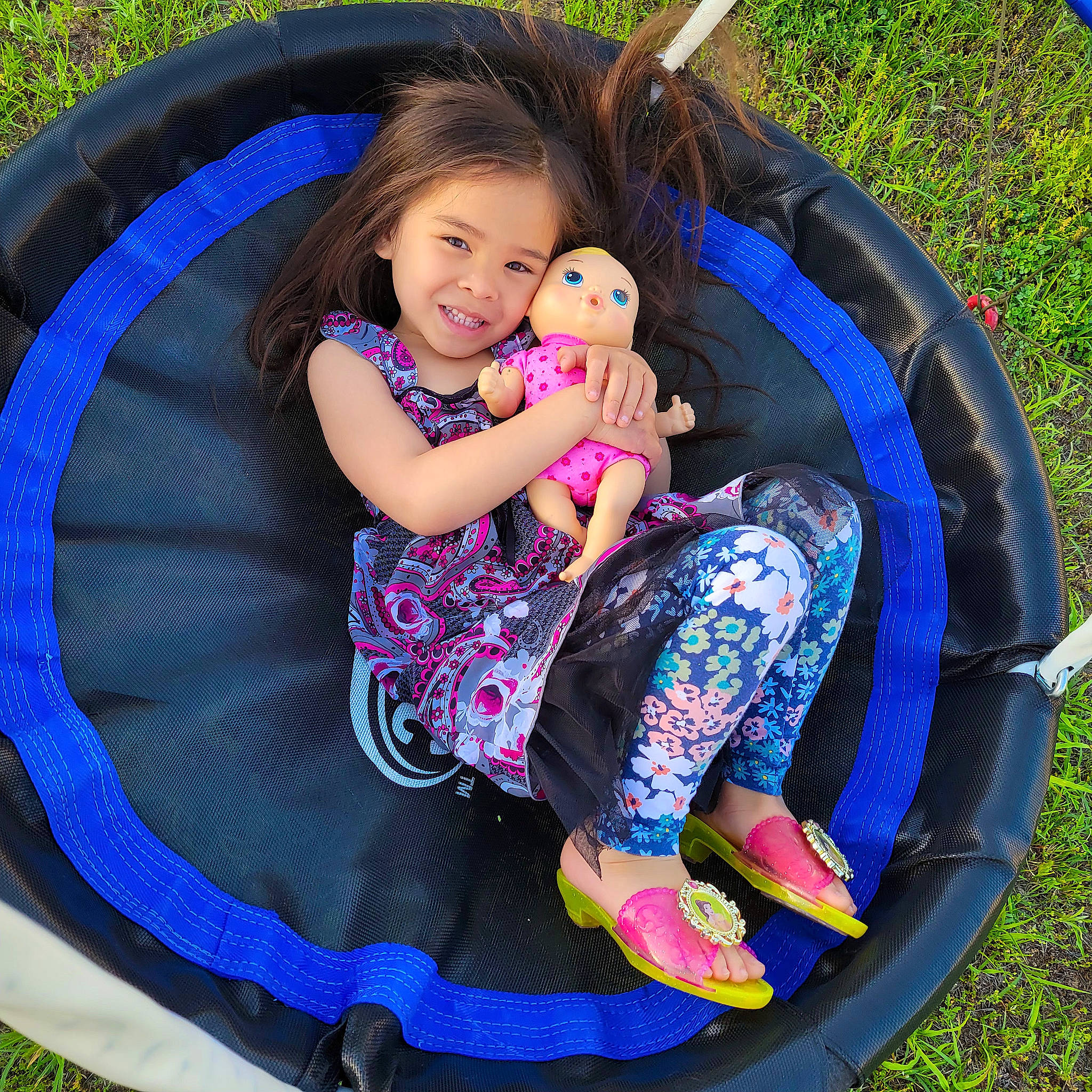 Jace is registered to the contest to win money with this photo: baby_toddler_clothing, beauty, child, circle, comfort, electric_blue, fun, grass, happy, joy, lap, leisure, outdoor_furniture, people_in_nature, person, play, recreation, sandal, shoe, sitting