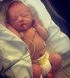 Michael Jr. is registered to the contest to win money with this photo: arm, baby, birth, cheek, child, childbirth, ear, hand, nap, nose, person, sleep, smile, toddler