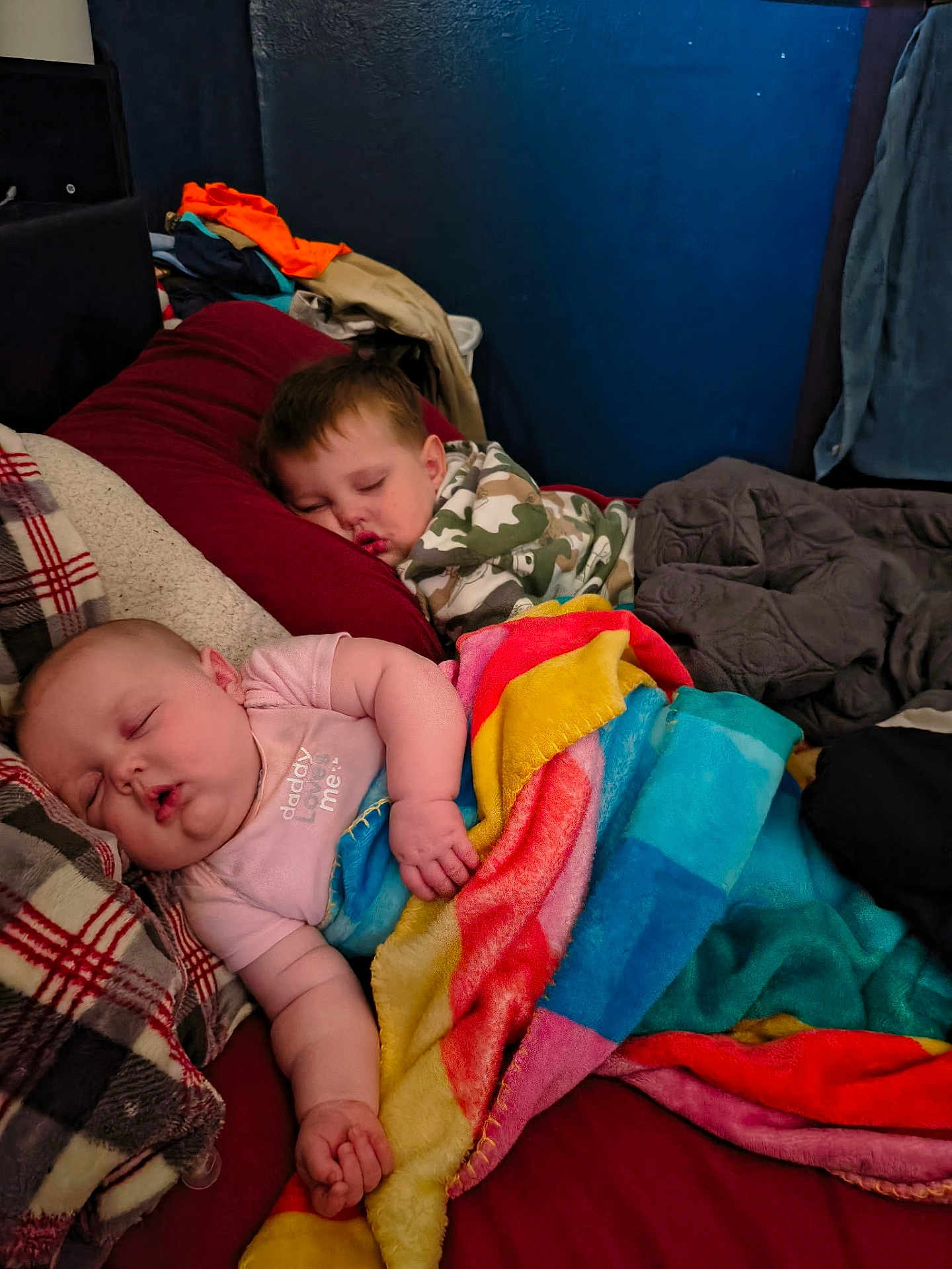 Willow joined the competition — help win amazing prizes! child, baby, toddler, sleeping, blanket, colorful_blanket, pillow, bed, bedroom, camo_clothing, plaid_blanket, bedding, cozy, sibling, interior, wall, nap, relaxed, clothes_pile, home