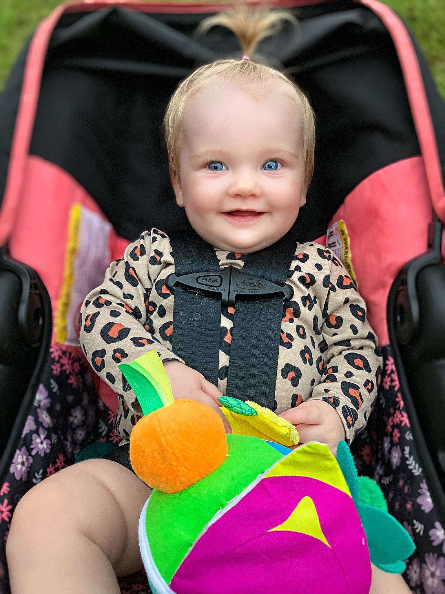 Oaklyn joined the competition — help win amazing prizes! baby, baby_carriage, baby_products, baby_toddler_clothing, child, eye, face, facial_expression, fashion_accessory, fun, grass, happy, head, human_body, joy, orange, person, photograph, sitting, skin