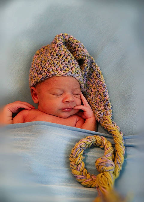 Kash is registered to the contest to win money with this photo: baby, baby_products, baby_sleeping, baby_toddler_clothing, bedtime, cap, child, comfort, crochet, eye, fashion_accessory, happy, headwear, knit_cap, linens, pattern, person, textile, toddler, wood