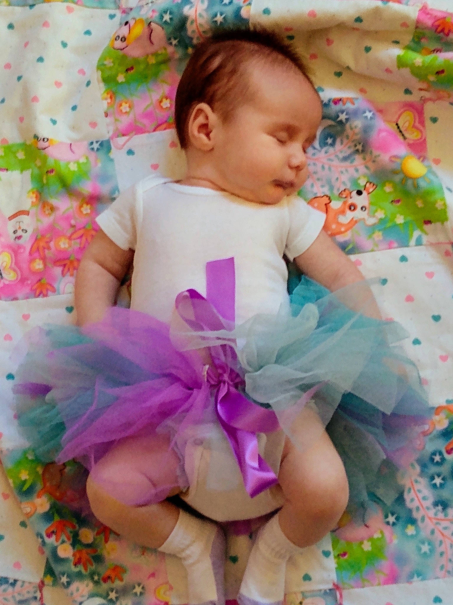 Josephine is registered to the contest to win money with this photo: baby, baby_toddler_clothing, child, costume, happy, person, pink, product, purple, smile, toddler