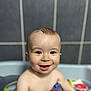 baby, child, smiling, bath, water, toy, blue_eyes, happy, skin, head, face, arm, tiled_wall, bathroom, cute, infant, playful, wet, person, young