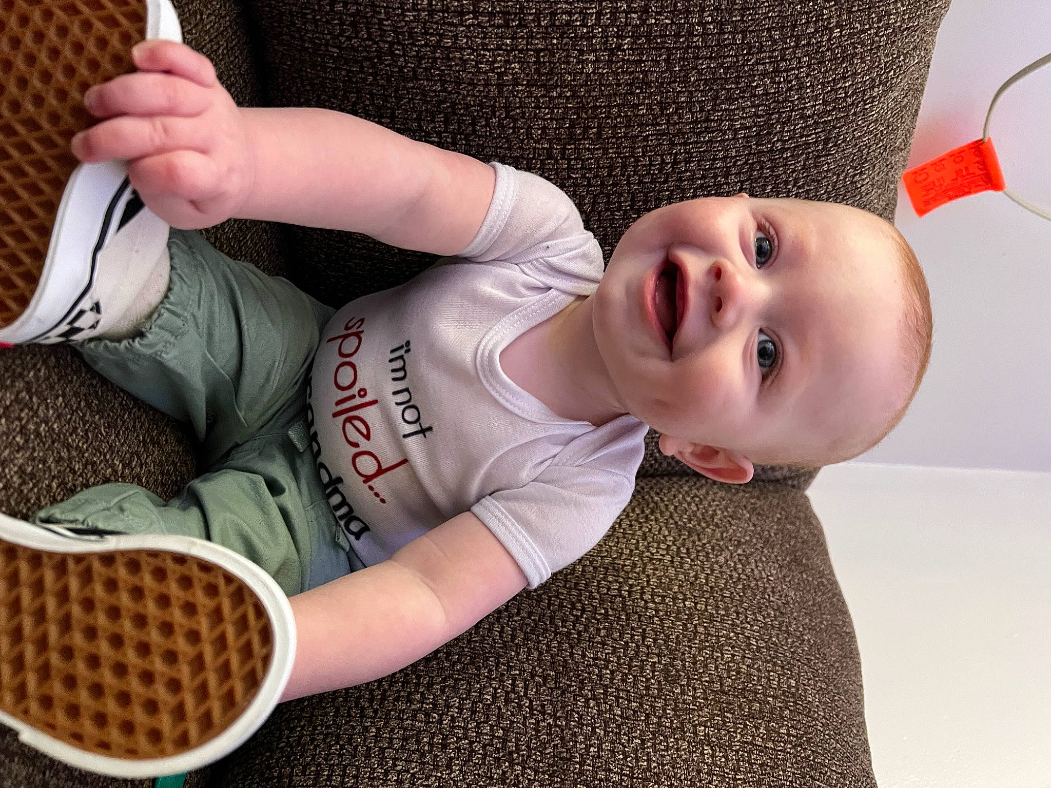 Alaric is registered to the contest to win money with this photo: arm, baby, baby_toddler_clothing, comfort, cool, finger, hand, happy, headgear, human_body, joint, joy, leg, mouth, person, product, sleeve, smile, sports_equipment, thigh