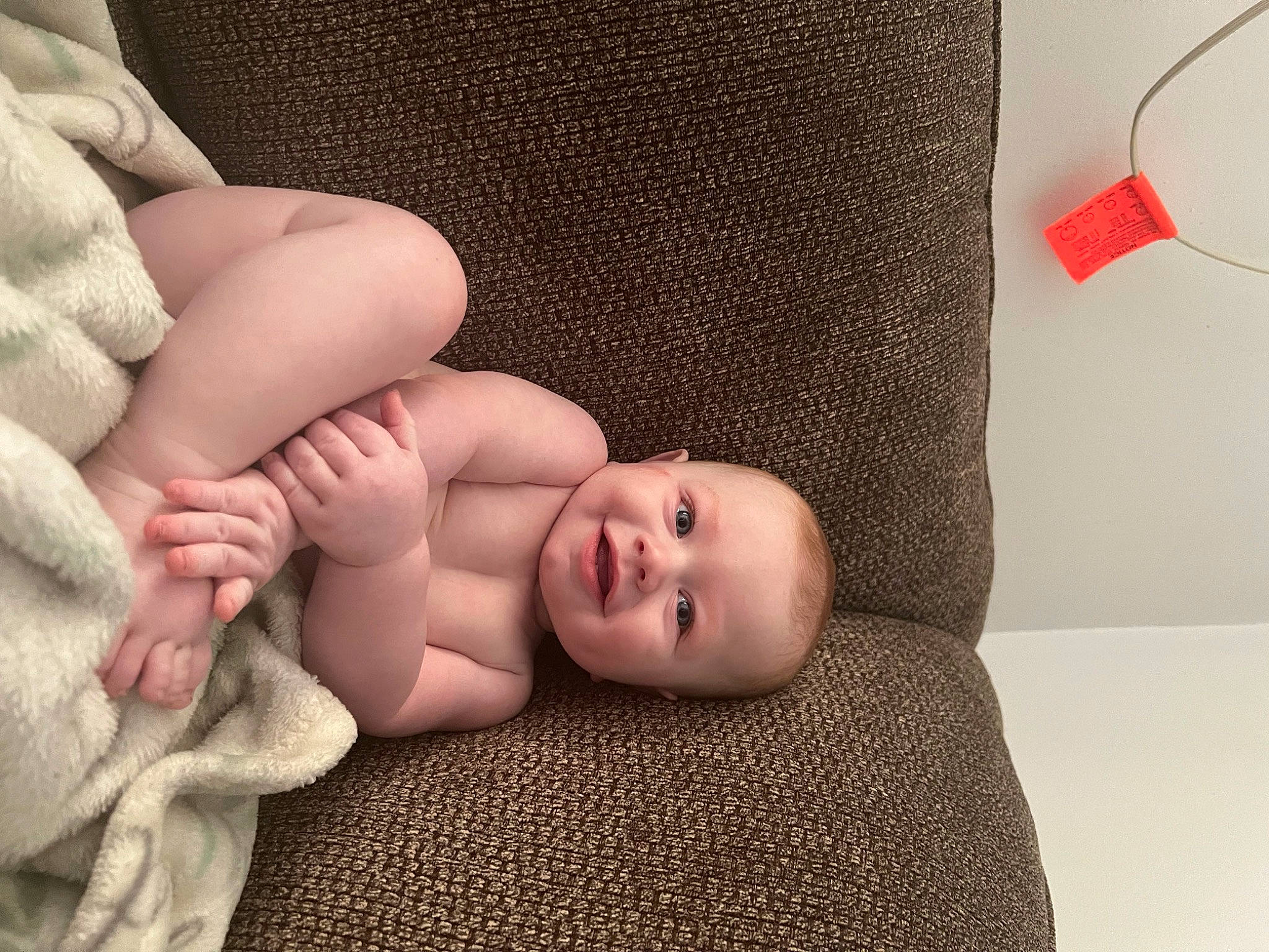 Alaric is registered to the contest to win money with this photo: arm, baby, baby_sleeping, baby_toddler_clothing, cheek, chin, comfort, finger, gesture, hand, headgear, human_body, joy, lip, mouth, person, skin, stomach, textile, thumb