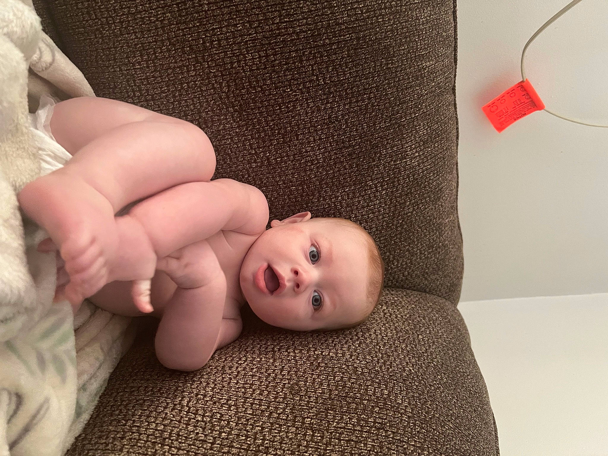 Alaric joined the competition — help win amazing prizes! arm, baby, baby_sleeping, baby_toddler_clothing, cheek, comfort, finger, flooring, foot, gesture, hand, head, headgear, lip, person, skin, surprise, textile, thumb, toddler