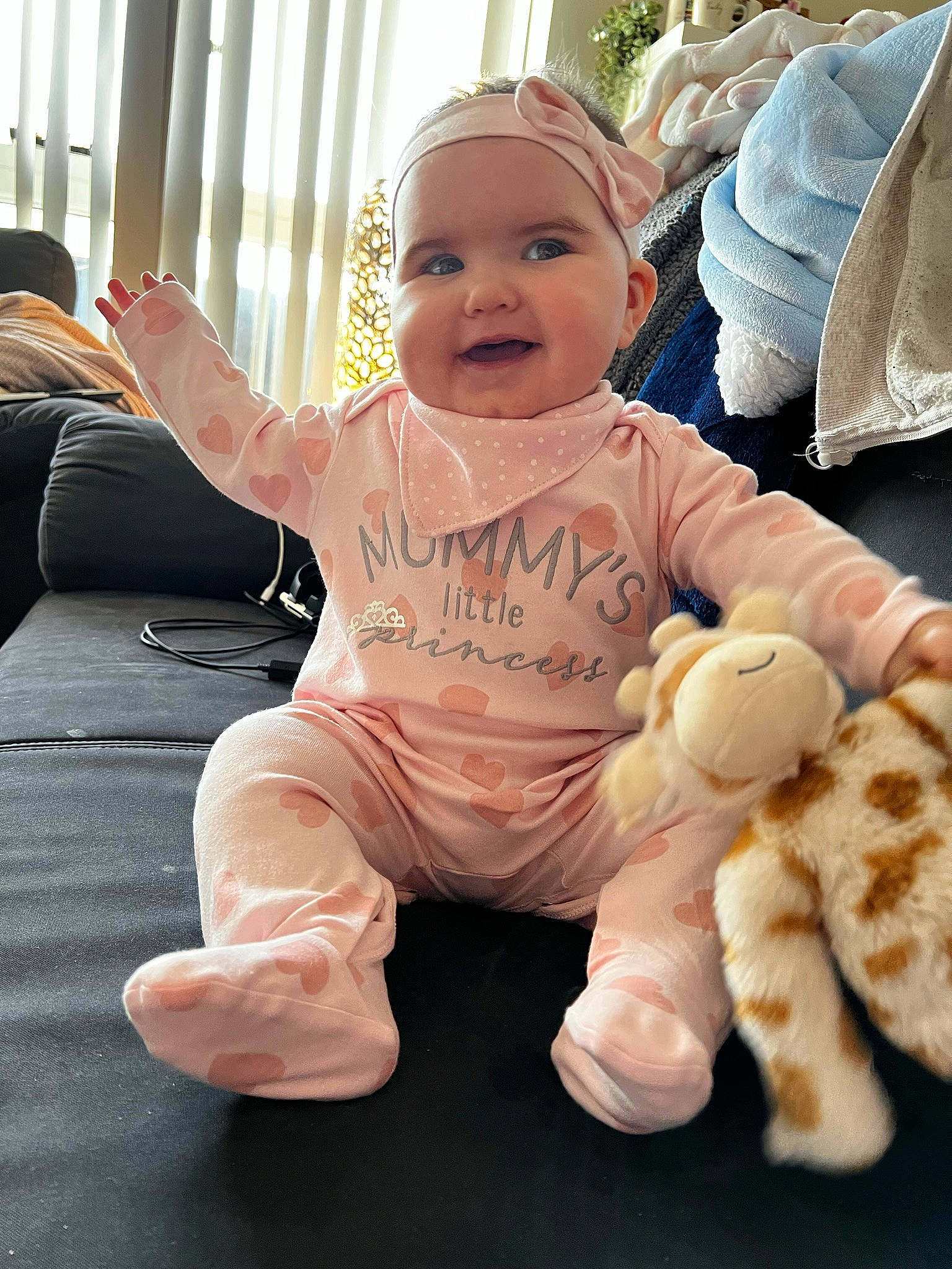 Delilah joined the competition — help win amazing prizes! baby, baby_toddler_clothing, cheek, child, comfort, face, finger, foot, gesture, happy, head, headwear, joy, mammal, person, pink, product, sitting, skin, sleeve