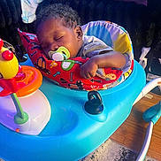 Legend joined the competition — help win amazing prizes! baby, sleeping, pacifier, baby_walker, pillow, colorful, toy, indoor, carpet, person, legs, couch, relaxing, child, infant, hand, foot, floor, home, comfort