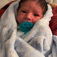 Santiago is registered to the contest to win money with this photo: newborn, baby, blanket, pacifier, face, wrapped, couch, soft, fur, infant, child, resting, cute, indoors, closeup, portrait, warm, cozy, sleepy, human