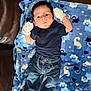 Santiago joined the competition — help win amazing prizes! animal_pattern, baby, blanket, blue_blanket, casual_clothing, child, cozy, cute, denim, footwear, indoor, infant, jeans, lying_down, mittens, navy_shirt, portrait, small_hands, soft_texture, wide_eyes