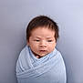 baby, blanket, blue, child, closeup, curious, cute, expression, face, hair, head, indoors, infant, newborn, portrait, skin, soft, swaddled, wrapped, young