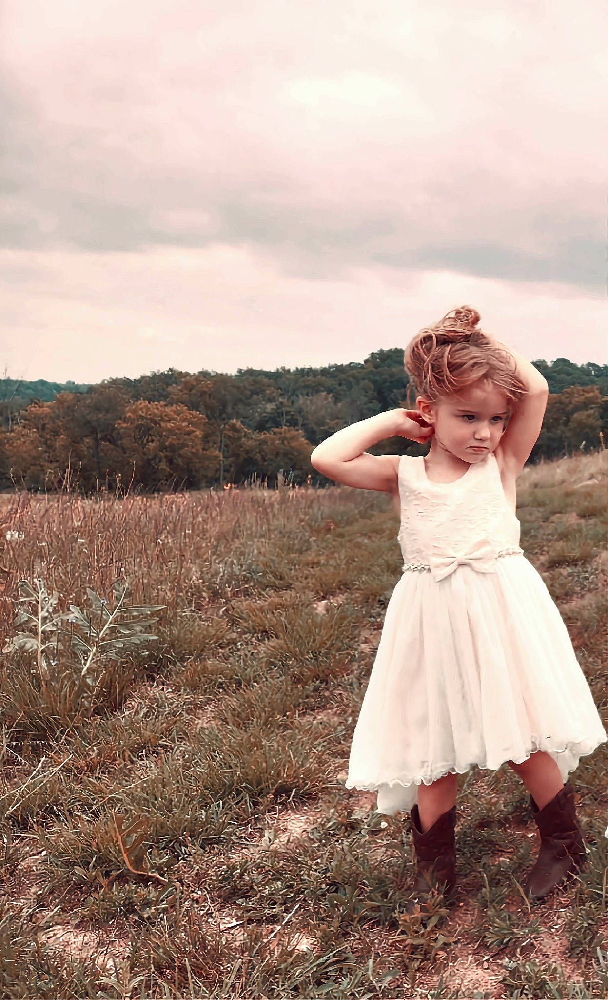 Raelynn is registered to the contest to win money with this photo: blond, bridal_clothing, cloud, dress, field, flash_photography, formal_wear, gesture, gown, grass, grassland, happy, landscape, meadow, people_in_nature, person, plant, prairie, sky, tree
