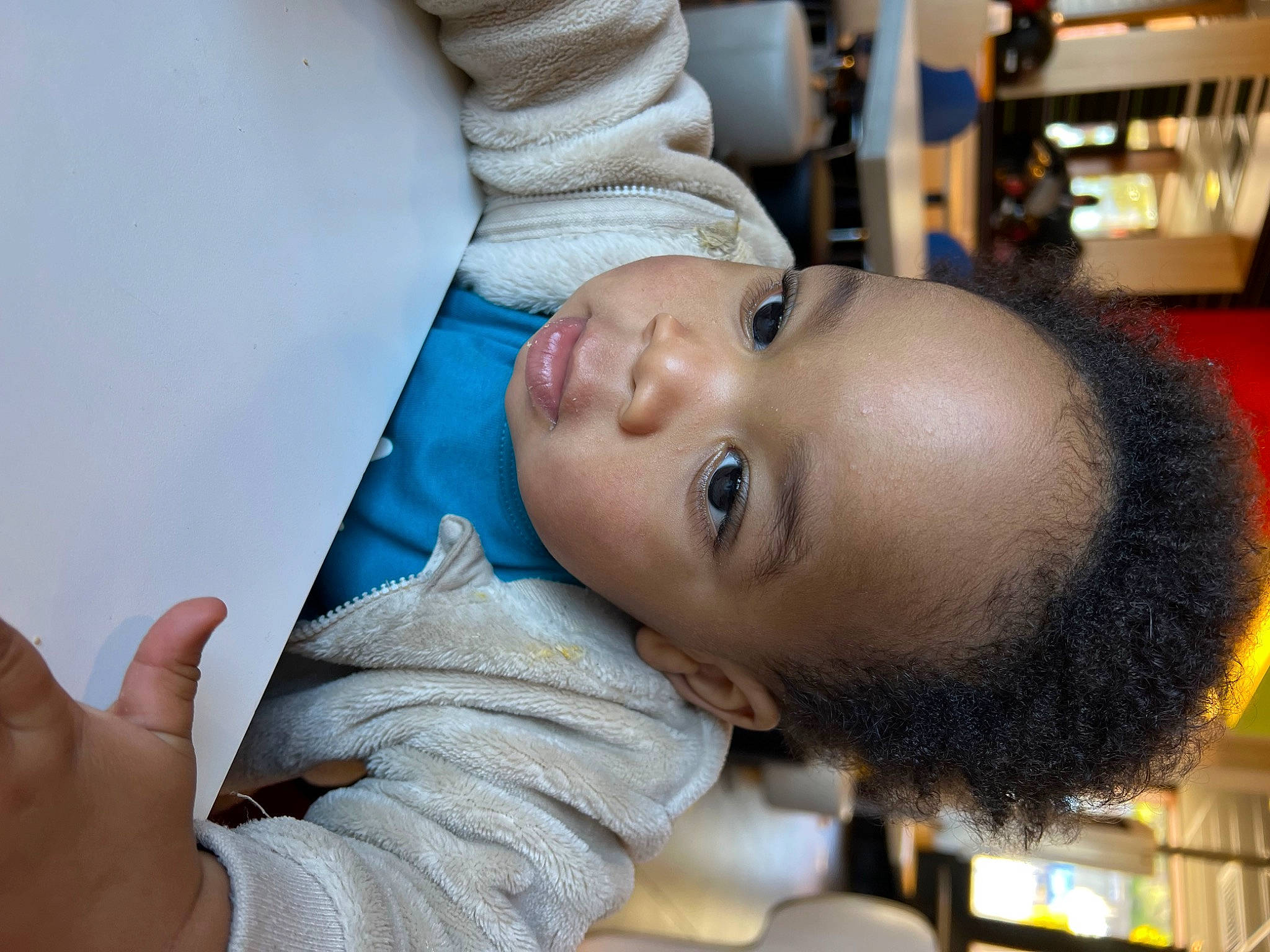 Isaïah participe au concours pour gagner de l'argent avec cette photo : baby, cheek, child, comfort, ear, eye, eyebrow, eyelash, fun, gesture, happy, mouth, nose, people, person, room, skin, thumb, toddler