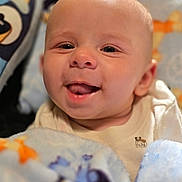 Jaxon is registered to the contest to win money with this photo: baby, bed, bedding, blanket, child, close_up, clothing, cozy, eyes, fabric, face, happy, head, indoors, infant, mouth, onesie, portrait, smiling, teddy_bear