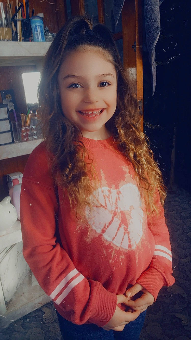 Amenia is registered to the contest to win money with this photo: arm, bookcase, clothing, cool, eyebrow, eyelash, facial_expression, flash_photography, hair, hairstyle, happy, iris, joy, lip, mouth, neck, organ, person, shelf, shoulder