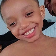 King is registered to the contest to win money with this photo: background, candid, casual, cheerful, child, expression, face, hair, happy, head, home, human, indoor, person, portrait, shoulders, skin, smiling, teeth, young