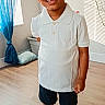 King is registered to the contest to win money with this photo: boy, casual_clothing, child, curtains, happy, home, indoors, nike_shoes, portrait, room, shadow, shorts, smiling, socks, standing, sunlight, wall, white_polo_shirt, window, wooden_floor