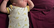 Colby is registered to the contest to win money with this photo: baby, sleeping, onesie, bed, blanket, infant, child, cute, animal_print, soft, peaceful, resting, indoors, pale_skin, short_hair, raised_arms, fabric, comfort, portrait, toddler