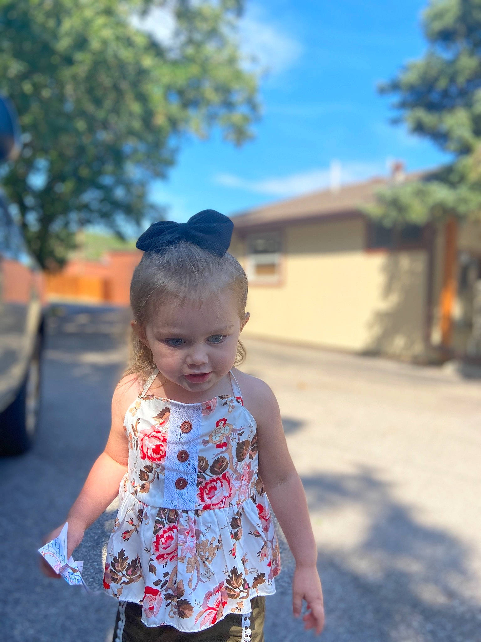 Brylee is registered to the contest to win money with this photo: asphalt, auto_part, baby, baby_toddler_clothing, child, day_dress, person, sleeveless_shirt, summer, sunlight, toddler