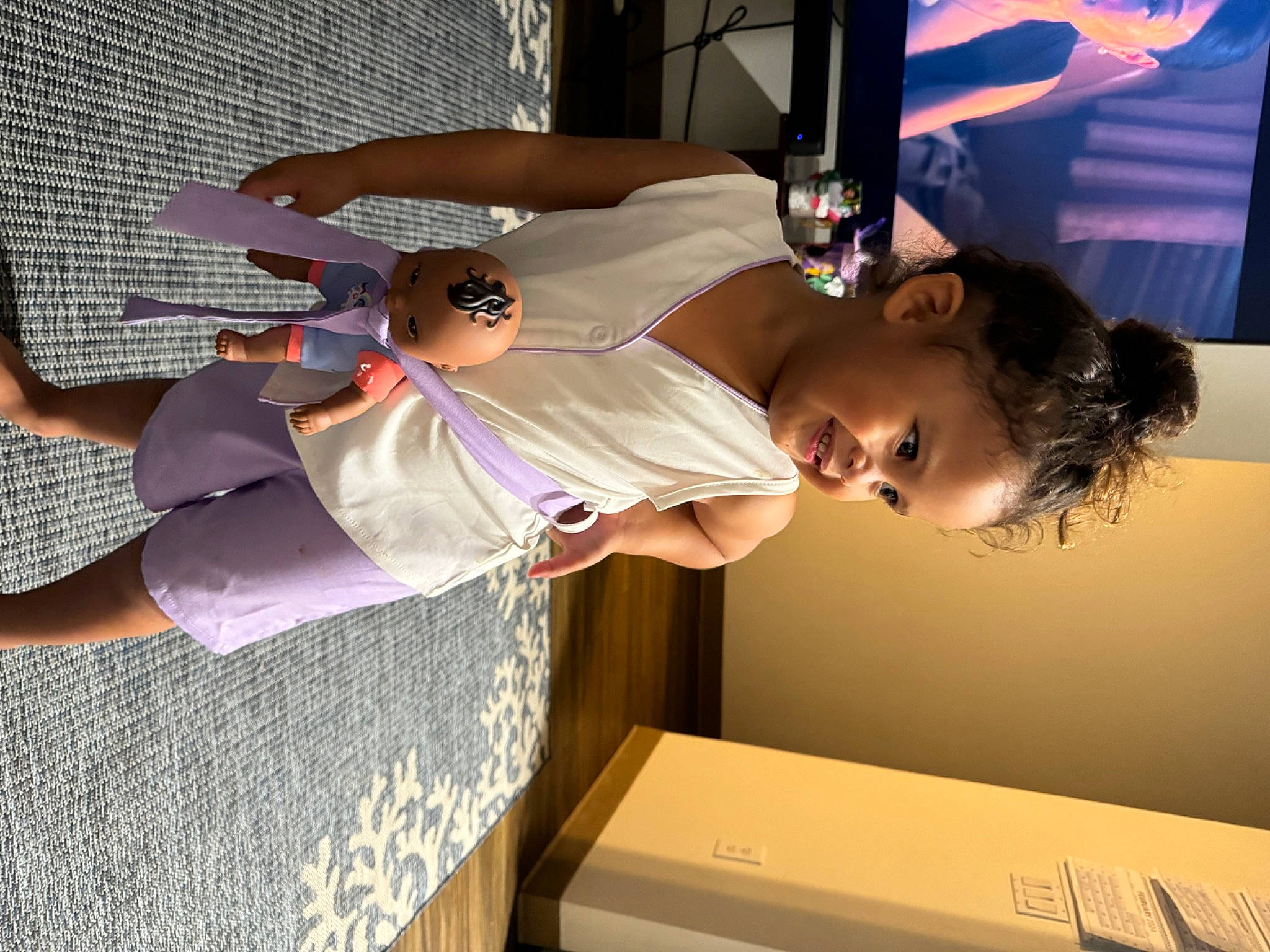 Zaeley-ann is registered to the contest to win money with this photo: arm, audio_equipment, child, display_device, elbow, event, eyewear, flat_panel_display, fun, hat, human_leg, led_backlit_lcd_display, leisure, person, room, t_shirt, television, television_set, thigh, toddler