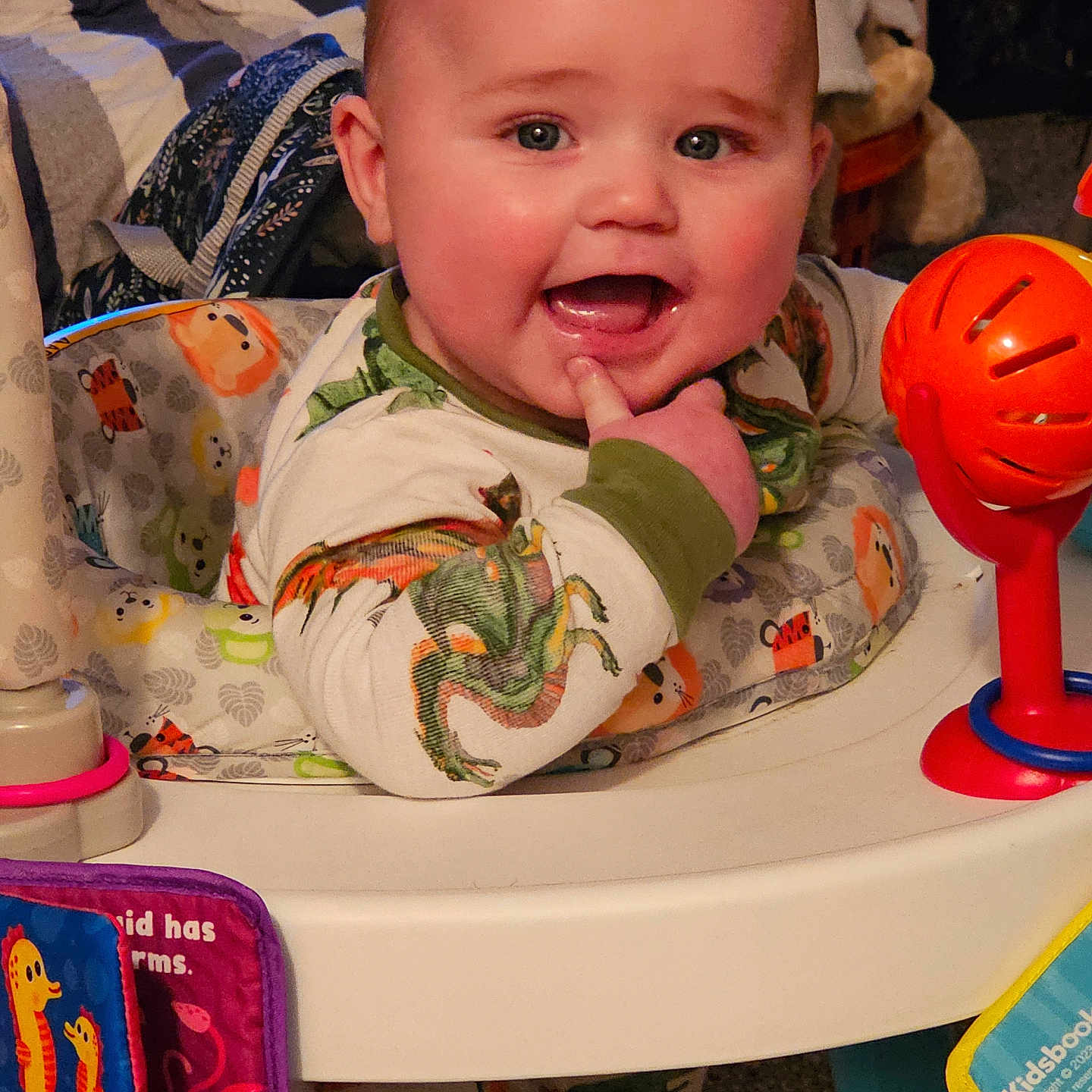 Oliver is registered to the contest to win money with this photo: baby, bodypart, clothing, crib, cutlery, face, finger, food, furniture, hand, happy, head, helmet, infantbed, person, photography, portrait, sweets, t_shirt, toy