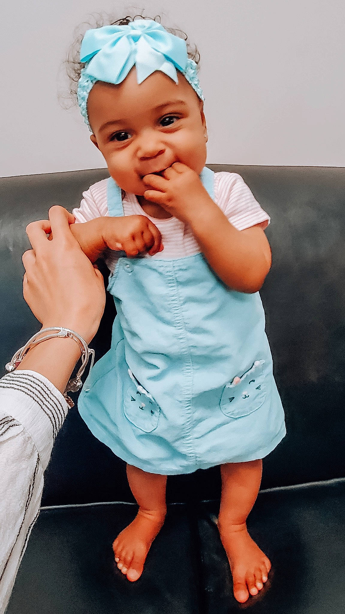 Nova Daniela is registered to the contest to win money with this photo: arm, azure, baby_toddler_clothing, blue, eye, facial_expression, flash_photography, gesture, hairstyle, hand, happy, headwear, human_body, joint, leg, muscle, organ, person, skin, standing