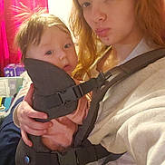 Arizona joined the competition — help win amazing prizes! baby, baby_carrier, bedroom, candid, casual, child, clothing, curtains, expression, face, hair, holding, indoor, light, parent, person, portrait, selfie, woman, young